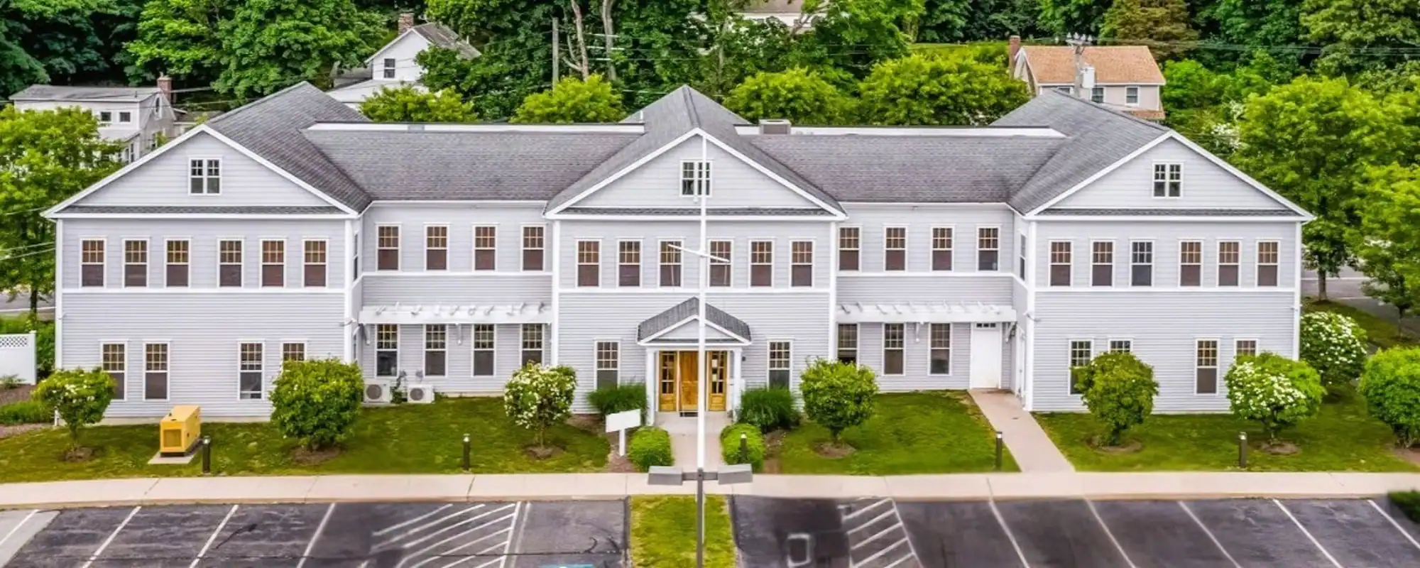 Modern white building of the Center for Children with Special Needs in Westbrook.