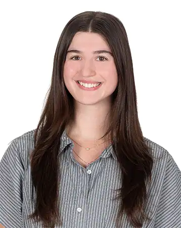 Portrait of Caitlin DellaRatta, smiling young woman at The Center for Children with Special Needs.